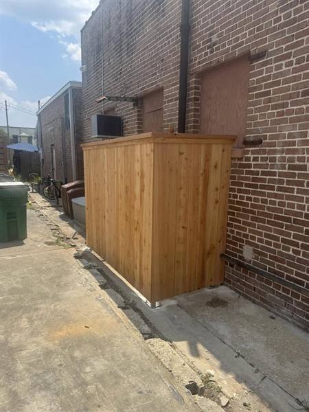 Custom cedar utility enclosure at a commercial building