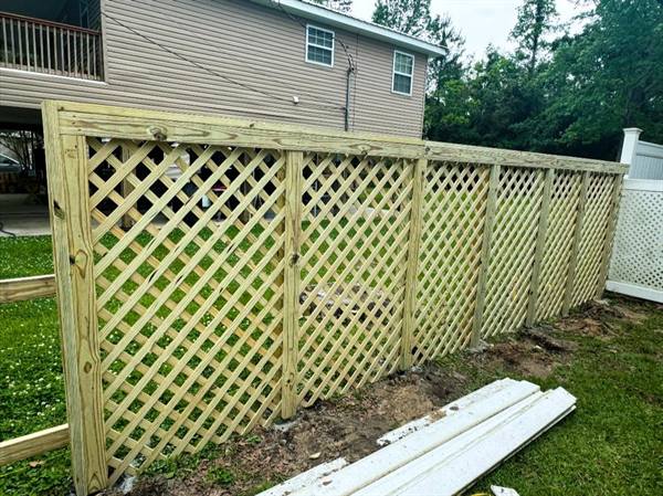 Treated pine lattice screen fence