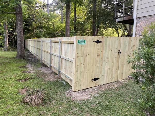 Treated pine privacy fence built on steel posts